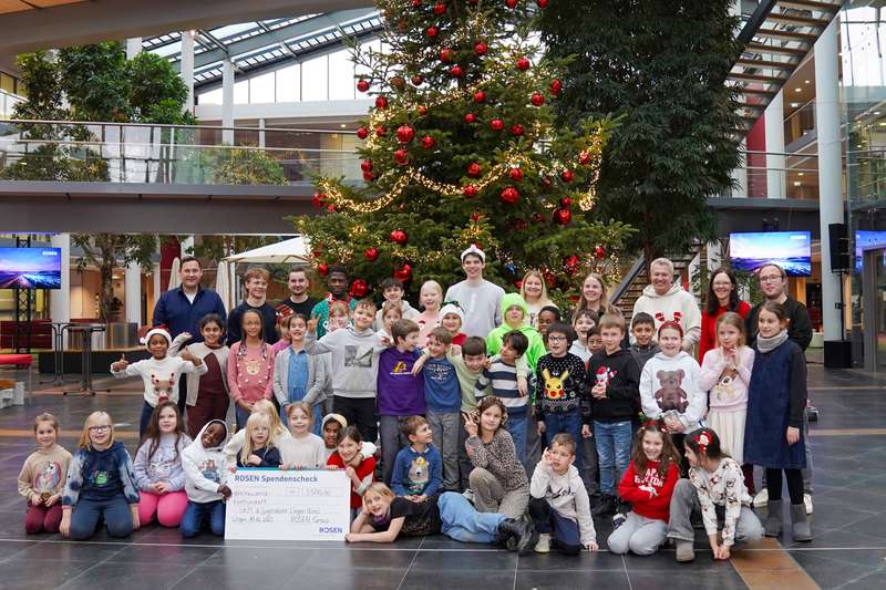 Christmas donation handover trainees and pupils rosen group
