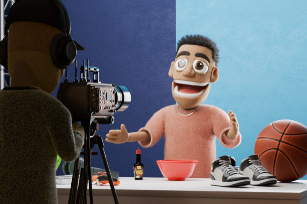 Animierte Figur mit Basketball und Schüssel, die vor einer Kamera spricht, während eine zweite Figur filmt.