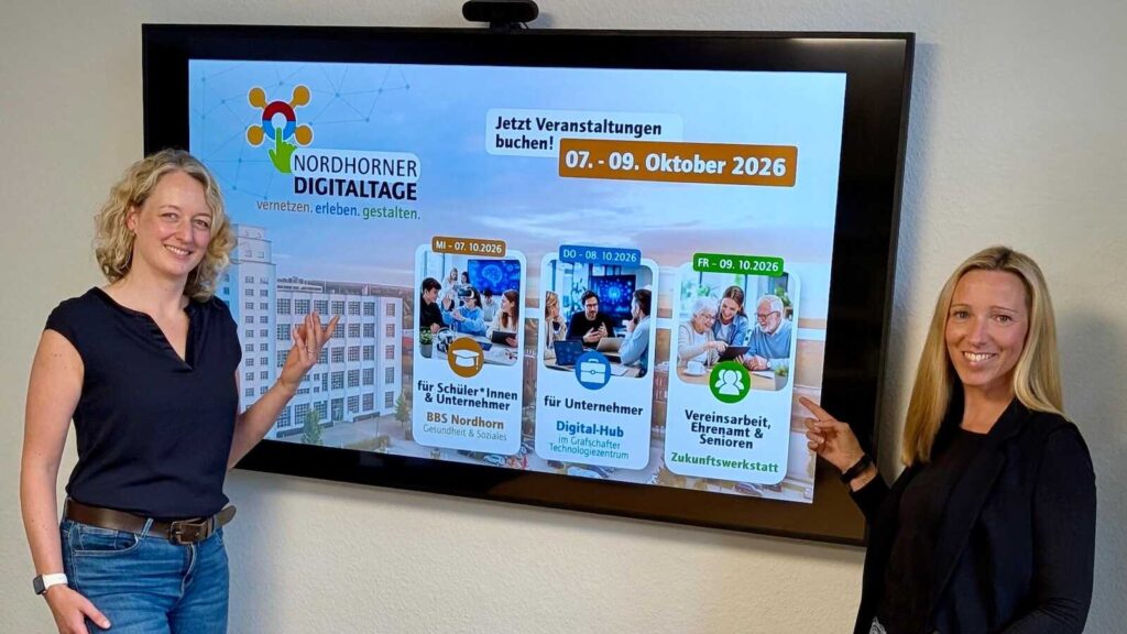 Zwei Mitarbeiterinnen der Wirtschaftsförderung der Stadt Nordhorn werben für die Nordhorner Digitaltage 2026