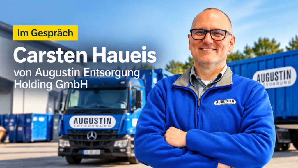 Carsten Haueis in Augustin-Fleecejacke vor Lkw und Containern von Augustin Entsorgung