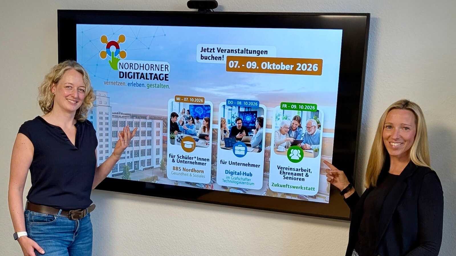 Zwei Mitarbeiterinnen der Wirtschaftsförderung der Stadt Nordhorn werben für die Nordhorner Digitaltage 2026