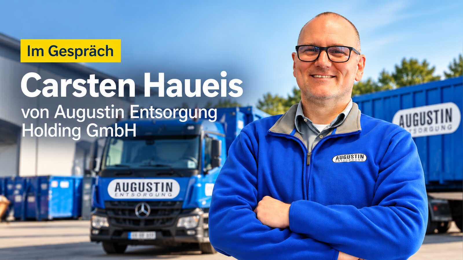 Carsten Haueis in Augustin-Fleecejacke vor Lkw und Containern von Augustin Entsorgung