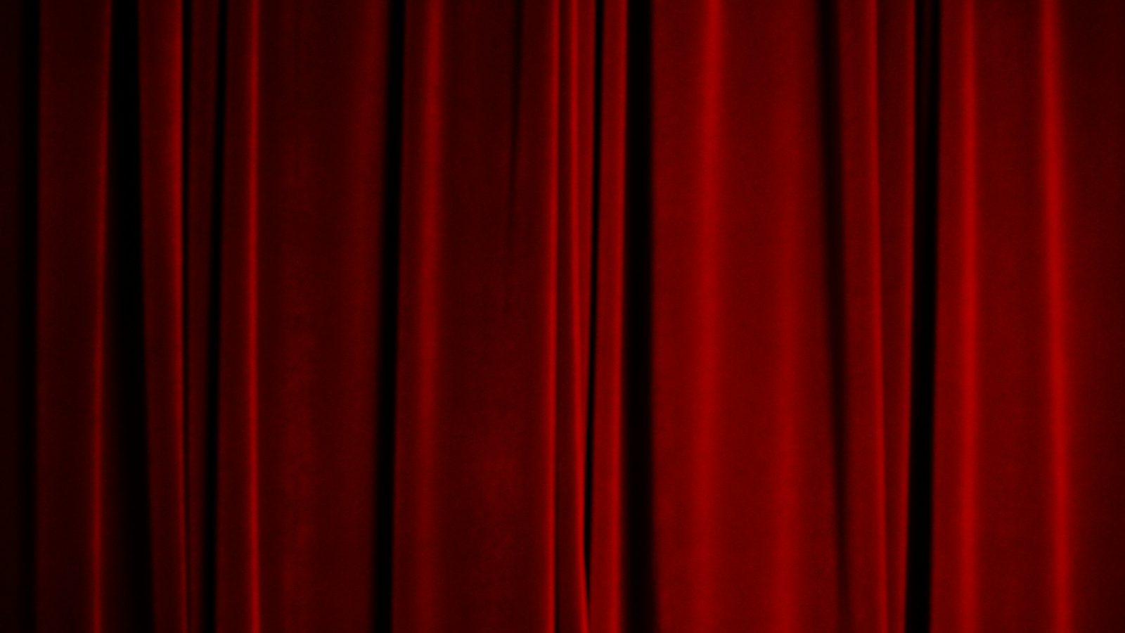 Roter Samtvorhang einer Theaterbühne